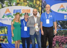 Brianna Posner, David Posner, Jared Bray and Joe Feldman with Awe Sum Organics. Jared shows a bag of organic avocados. It's a new program for the company.